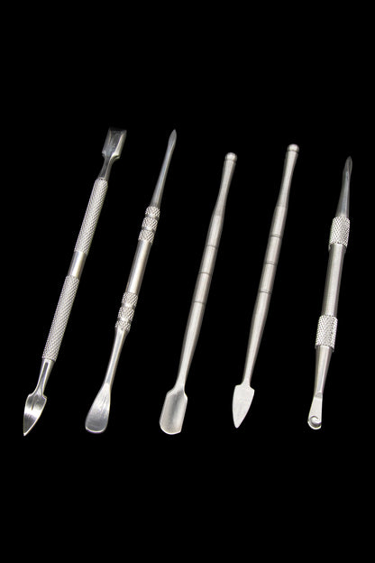 Silver dab tools for cannabis concentrates arranged on a black background.
