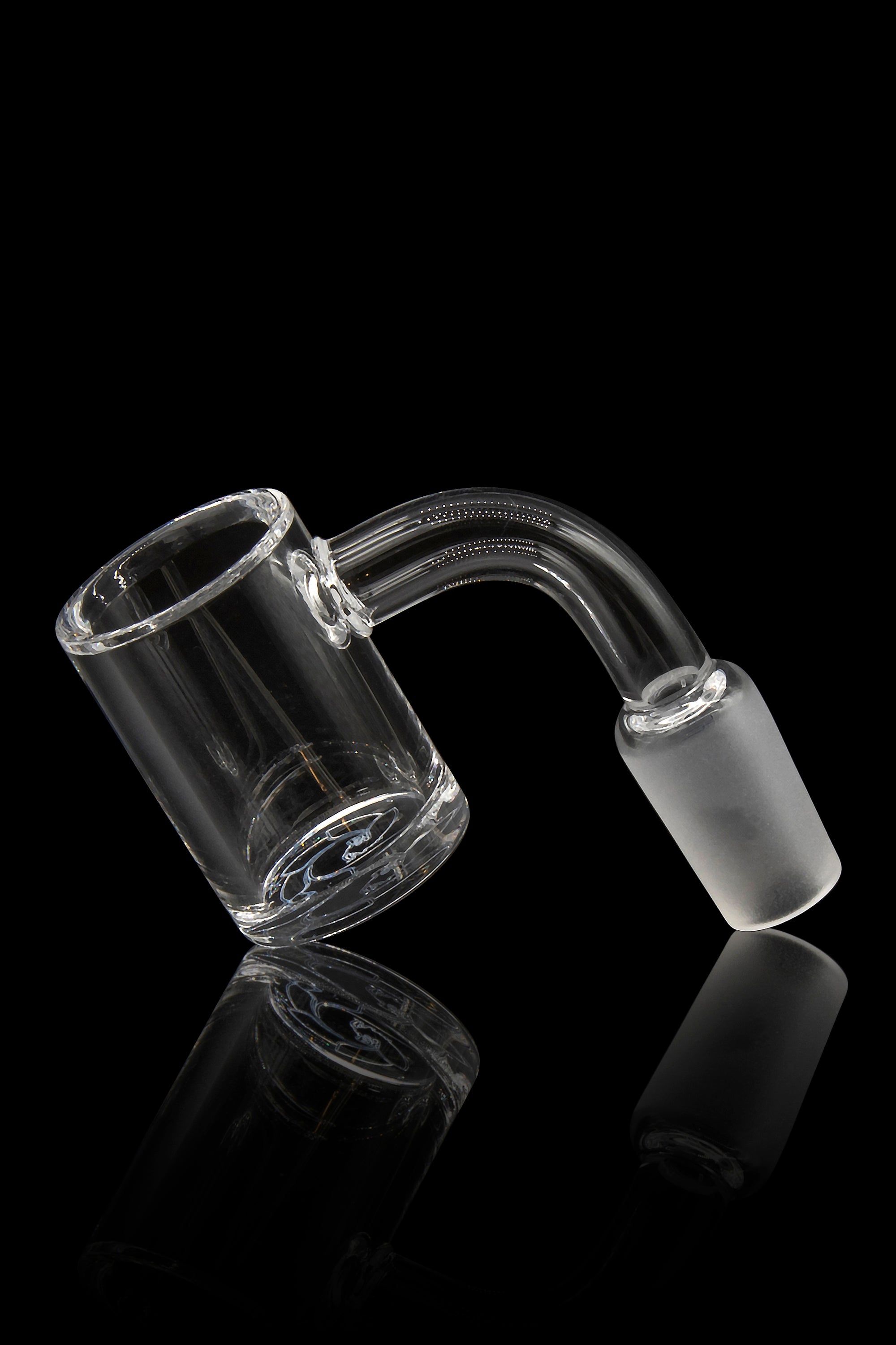 Clear glass dab rig nail with a bent neck, reflecting on a black surface.
