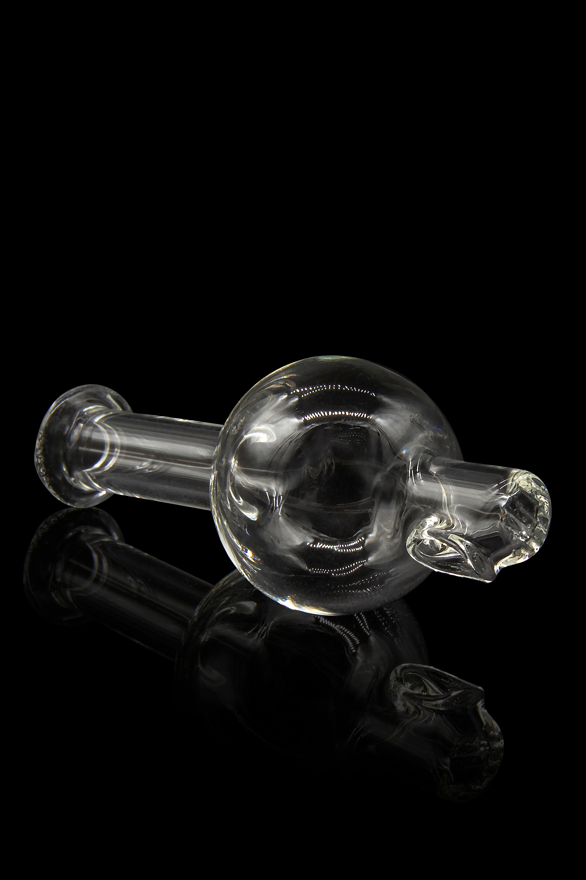Clear glass bubbler pipe against a black background.