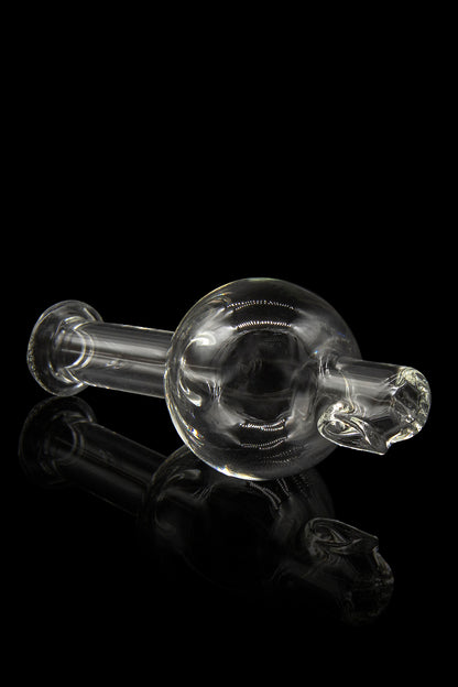 Clear glass bubbler pipe against a black background.