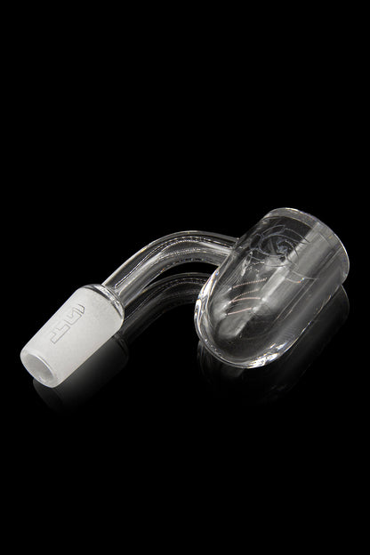 Clear glass cannabis oil dome with a titanium tip.