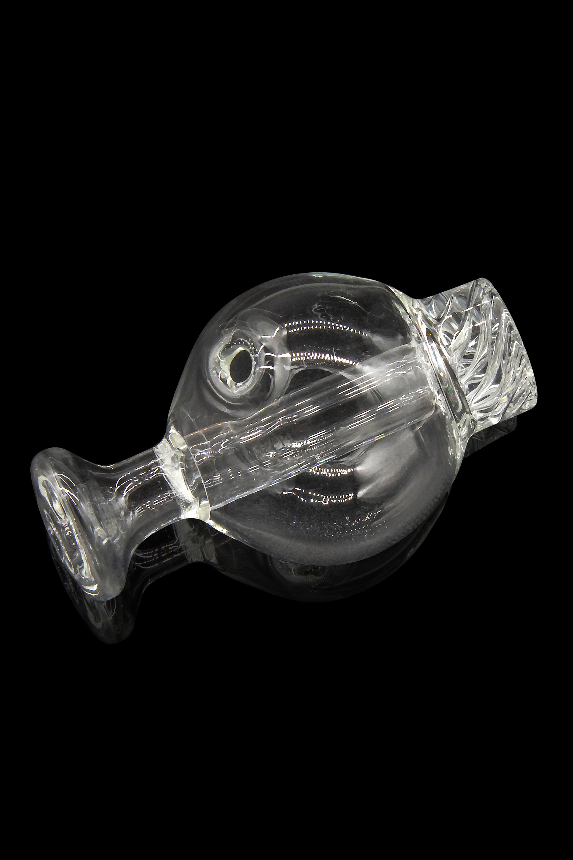 Clear glass bubbler for smoking cannabis, isolated on a black background.