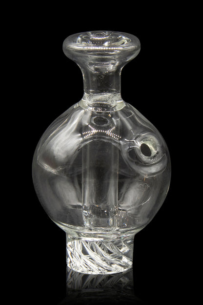 Clear glass cannabis concentrate dome with intricate internal designs.