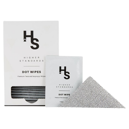 Front-facing boxed Higher Standards Dot Wipes - Box of 30 with a single sachet propped in front and a textured dotted wipe partially unfolded.