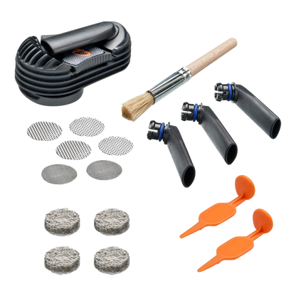 A flat lay of the Storz & Bickel Crafty Wear & Tear Set, featuring replacement parts and cleaning brushes against a white background.