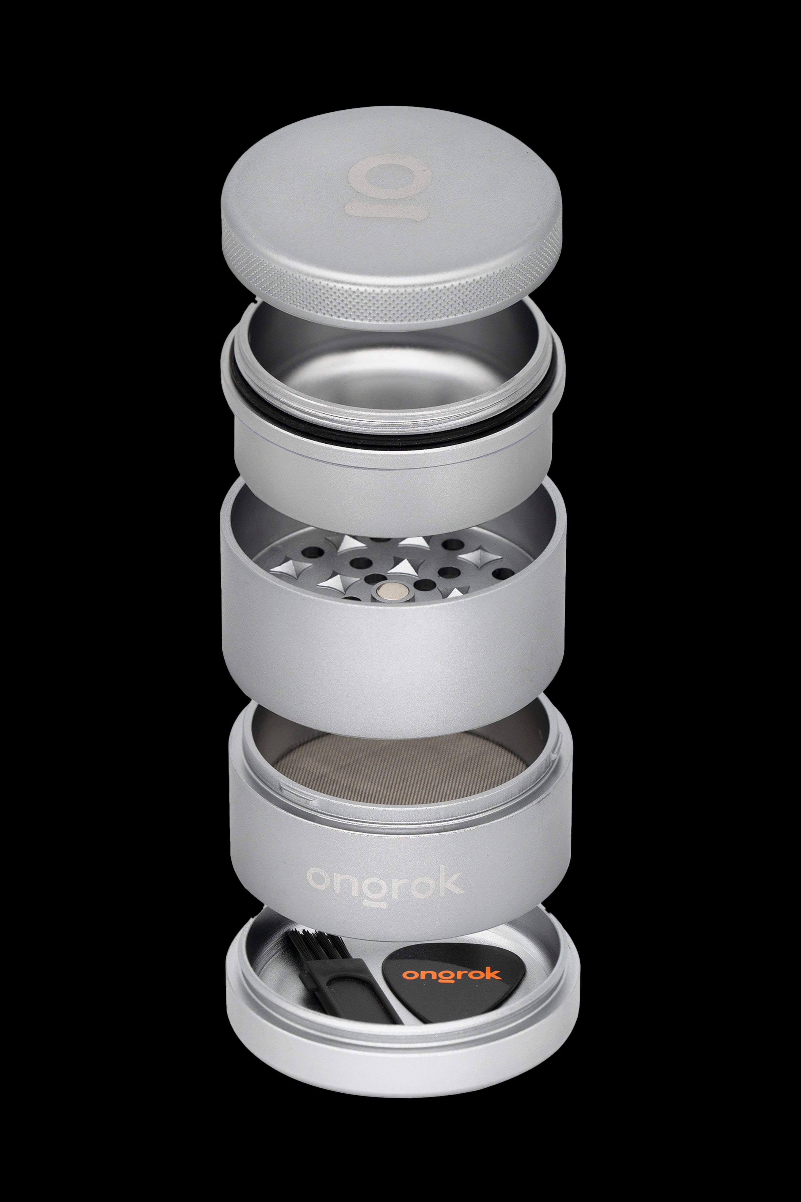 Silver cannabis grinder disassembled, showing multiple chambers and a cleaning brush in a bright orange base.