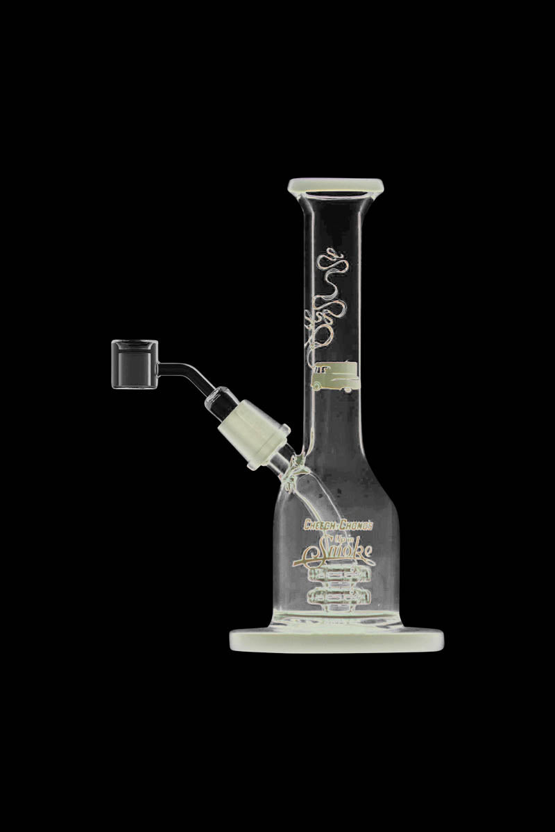 A side view of the Cheech & Chong "Jade East" Mini Rig Dabber, displaying its clear glass construction and compact size.