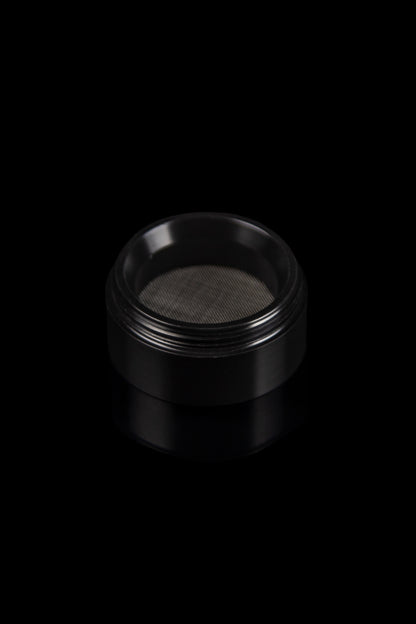 Black metal grinder with mesh screen.