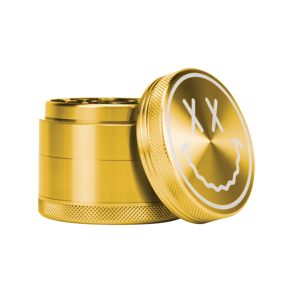 The open Goody Big Face Travel Size Grinder is pictured from a slight top-down angle, revealing its metallic finish and face design.