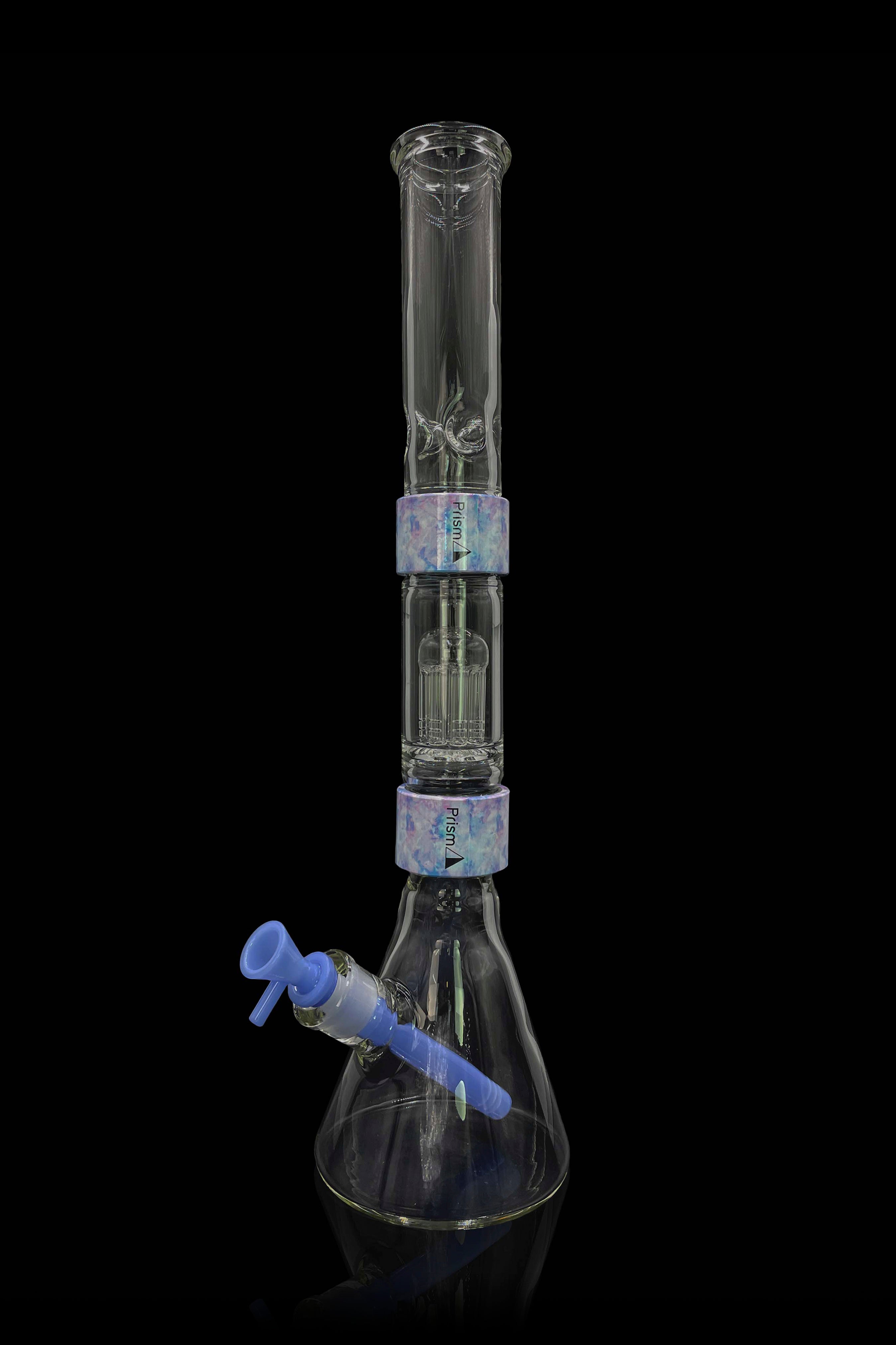 Glass bong with ice catch and patterned sections, against a black background.