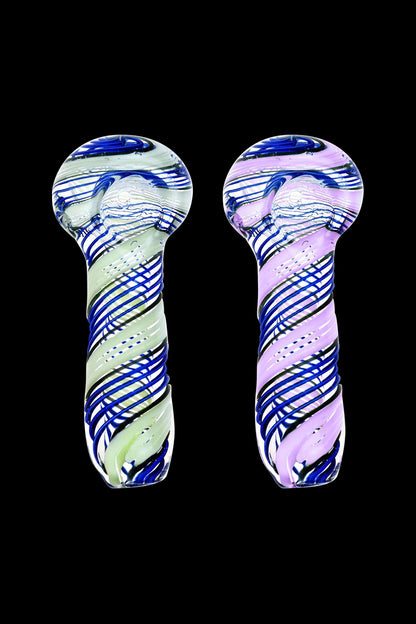 A close-up, angled view of the Spoon - Blue with Slime Twist, showing its curved shape and swirling blue and green glass pattern.