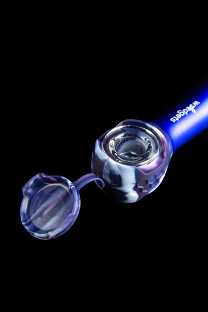 Glass cannabis pipe with iridescent purple and blue swirls, isolated on a black background.