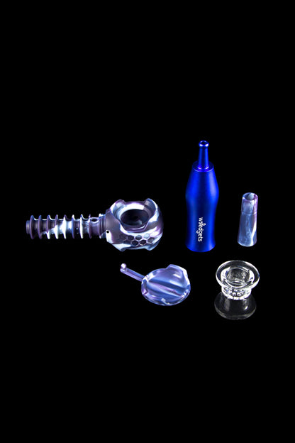 Cannabis accessories including a dab rig, quartz banger, carb cap, and glass tips, arranged on a black background.