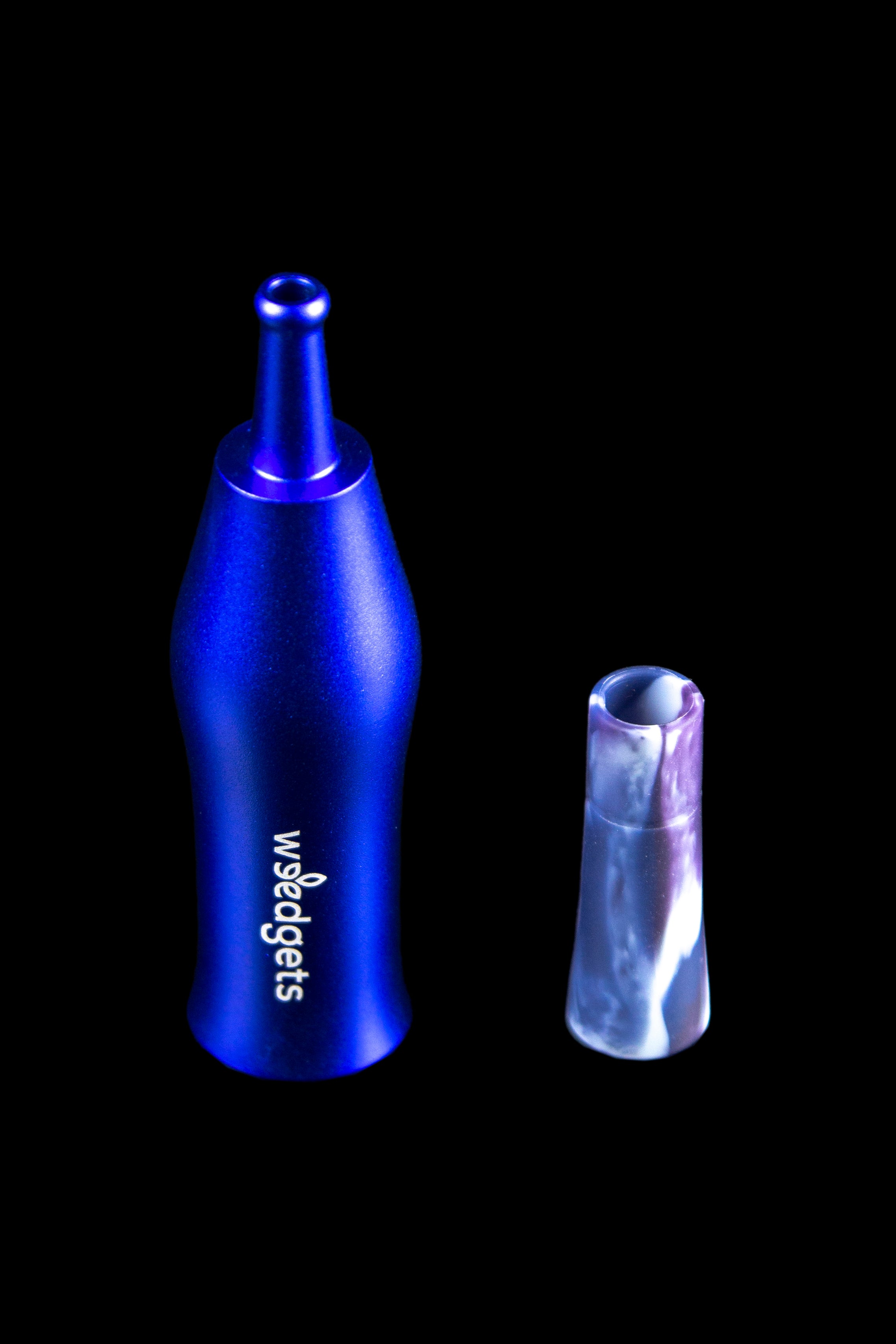 Blue cannabis oil burner pipe and glass filter tip on a black background.