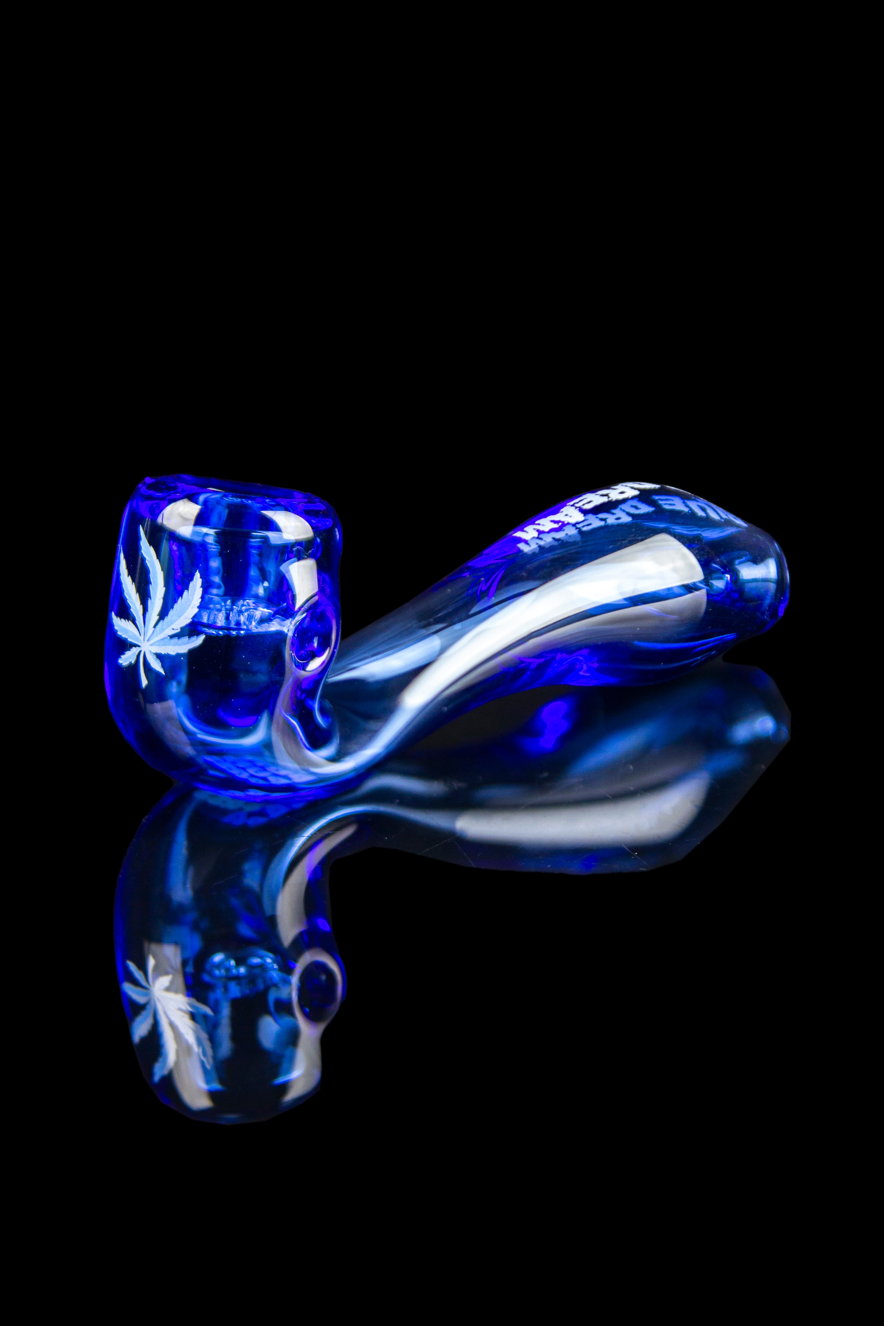 Blue glass pipe with cannabis leaf design, isolated on black.