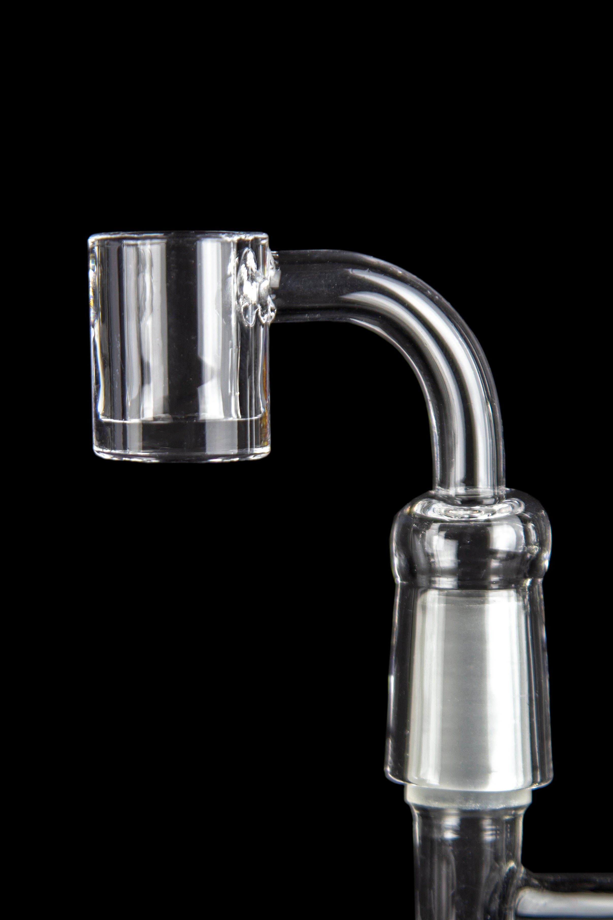 Clear quartz banger for vaporizing cannabis concentrates, against a black background.