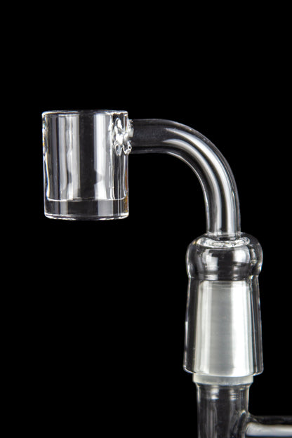 Clear quartz banger for vaporizing cannabis concentrates, against a black background.