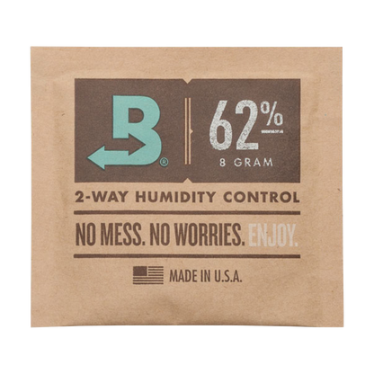 Close-up of the Boveda Humidity Control Pack for Dry Herbs - 62%, displaying a white label with bold black text against a brown background.