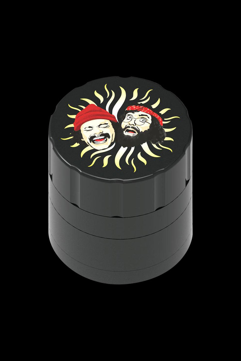 Front view of the Cheech & Chong 40th Anniversary Grinder, a cylindrical metal grinder with engraved portraits.
