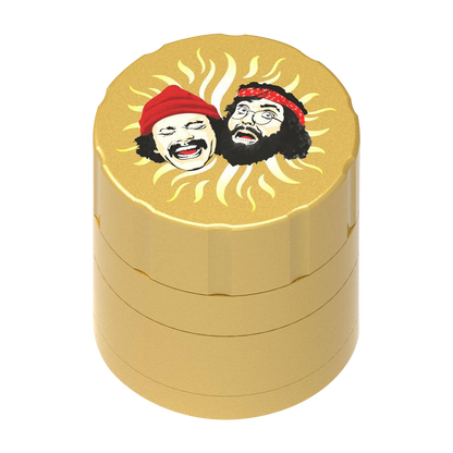 A top-down view of the Cheech & Chong 40th Anniversary Grinder, showcasing a golden, multi-tiered cylindrical design.
