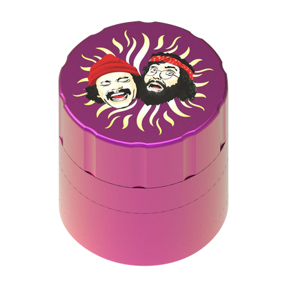 Front view of the Cheech & Chong 40th Anniversary Grinder, featuring a colorful graphic design on a metallic silver cylindrical base.