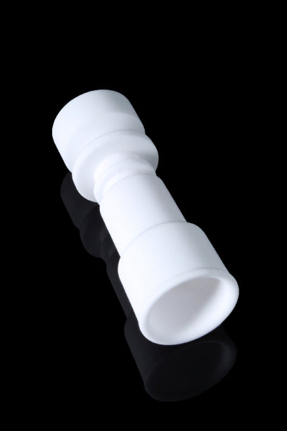 A studio shot of the Dual Function Female Ceramic Nail, angled to showcase its smooth, ceramic construction.