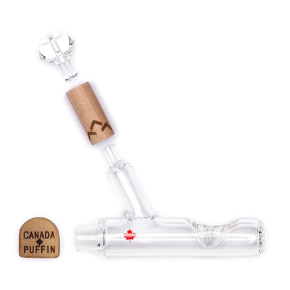 A three-quarter view of the Canada Puffin Chalet Steamroller, a clear glass pipe with a simple, straight design.