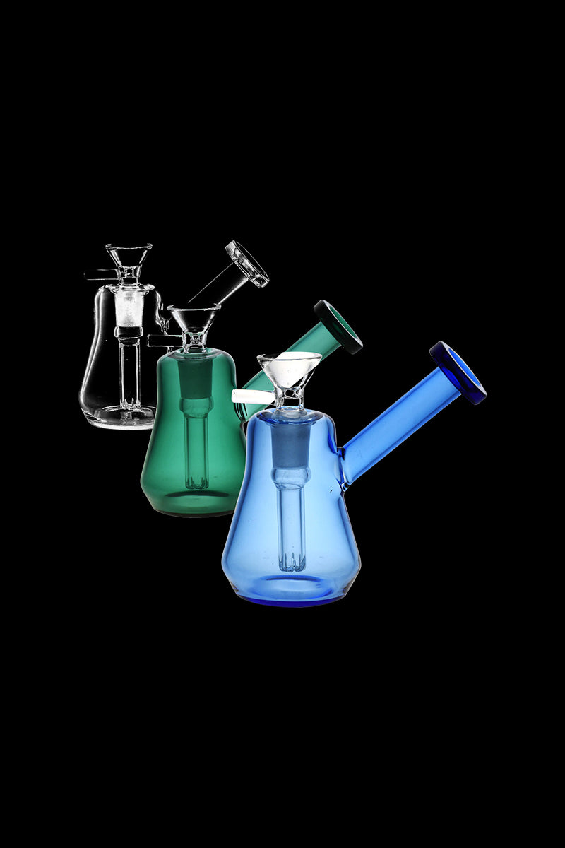 A studio shot of the Compact Travel Bubbler, showcasing the clear glass bubbler from a slightly elevated angle on a black backdrop.