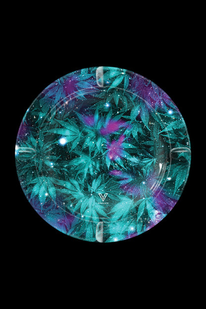 A circular tray with a cosmic cannabis leaf pattern, featuring teal, purple, and glitter accents, with a brand logo at the center.