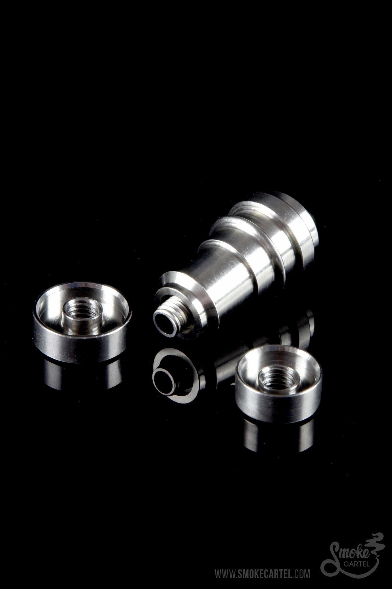 Silver dab rig components against a black background.