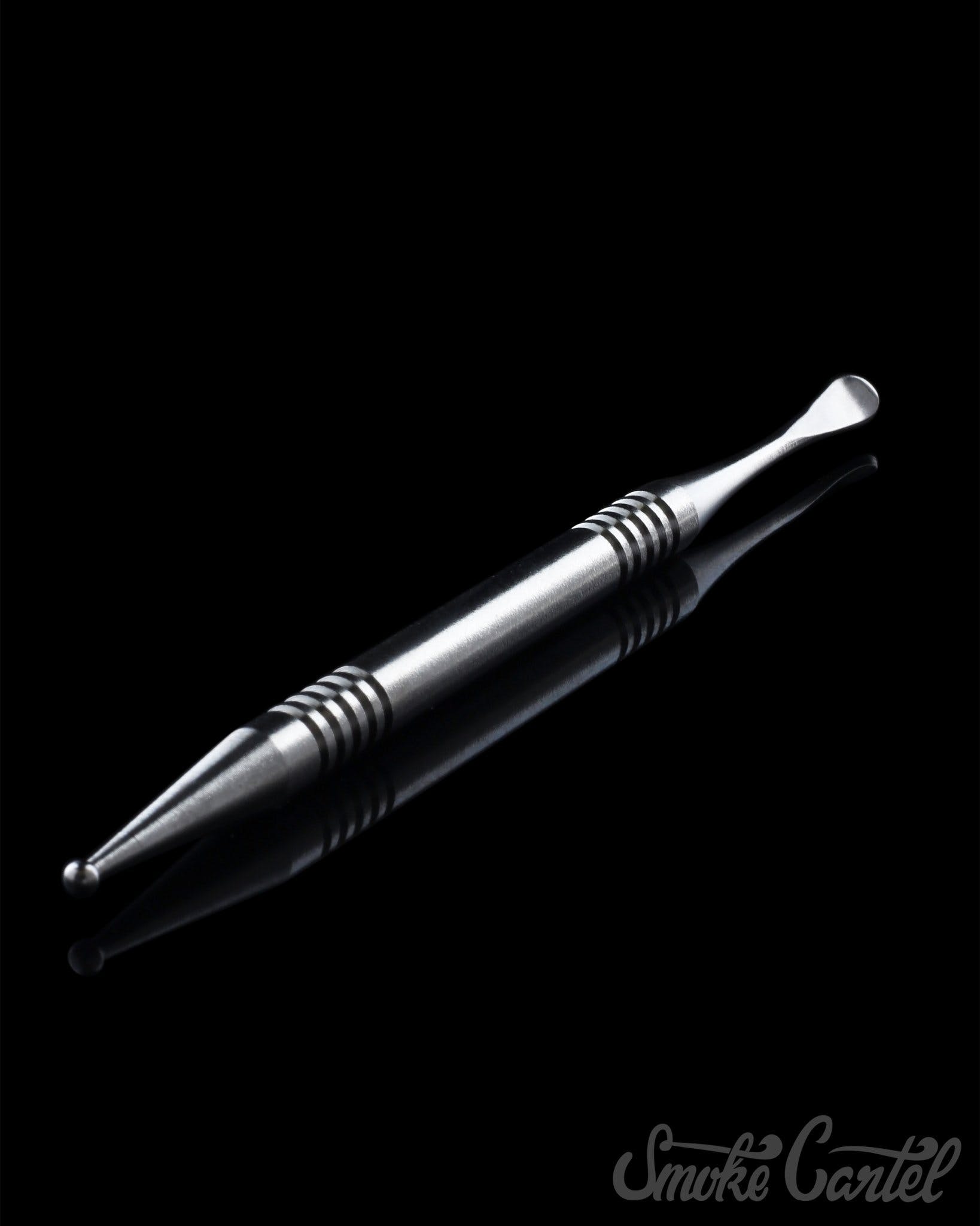 A close-up view of the 4" Titanium Grade 2 Dual End Dabber Tool, showcasing its metallic sheen and pointed tip against a dark background.