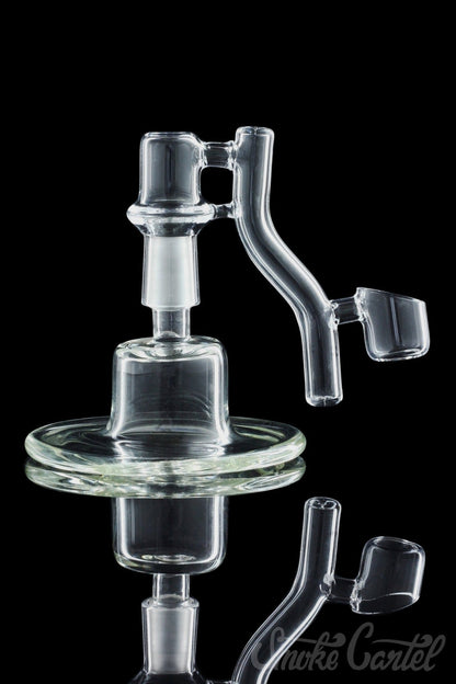 A studio shot of the Dropdown Quartz Reclaimer, displaying its transparent glass construction and curved design against a dark background.