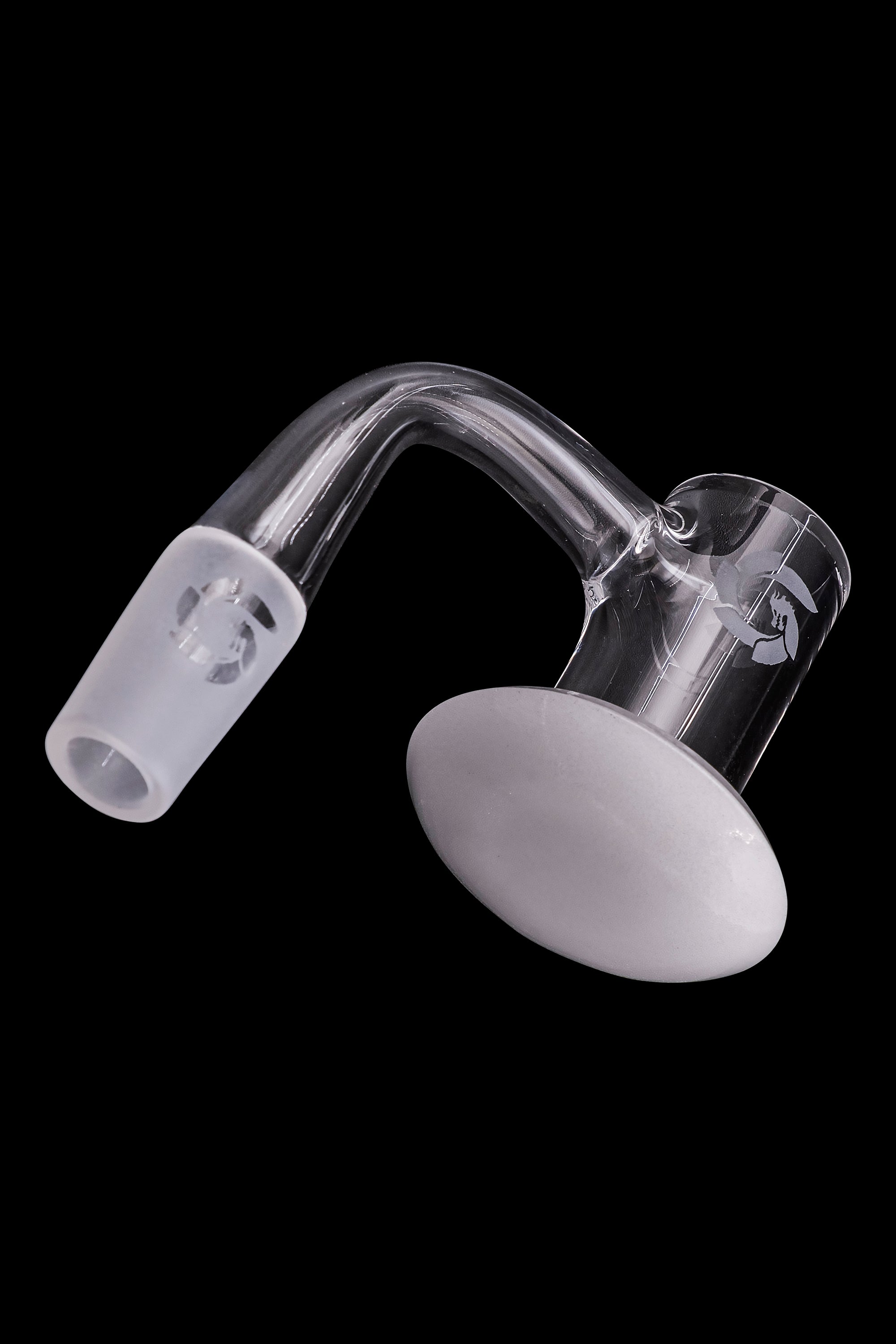 Clear glass carb cap for dabbing cannabis concentrates, isolated on a black background.