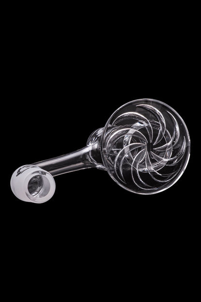Clear glass pipe with intricate swirling design, isolated on black.