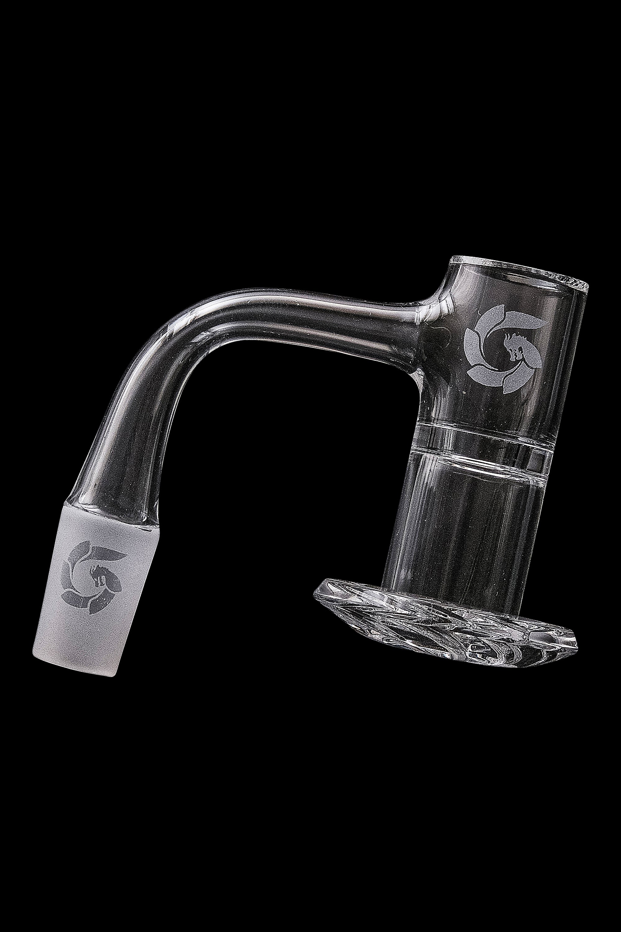Clear glass dab rig with a curved neck and intricate etched design, displayed against a black background.