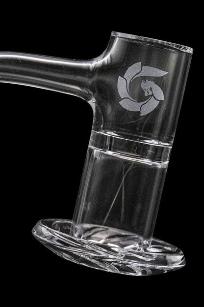 Clear glass dab rig with etched logo, isolated on black.