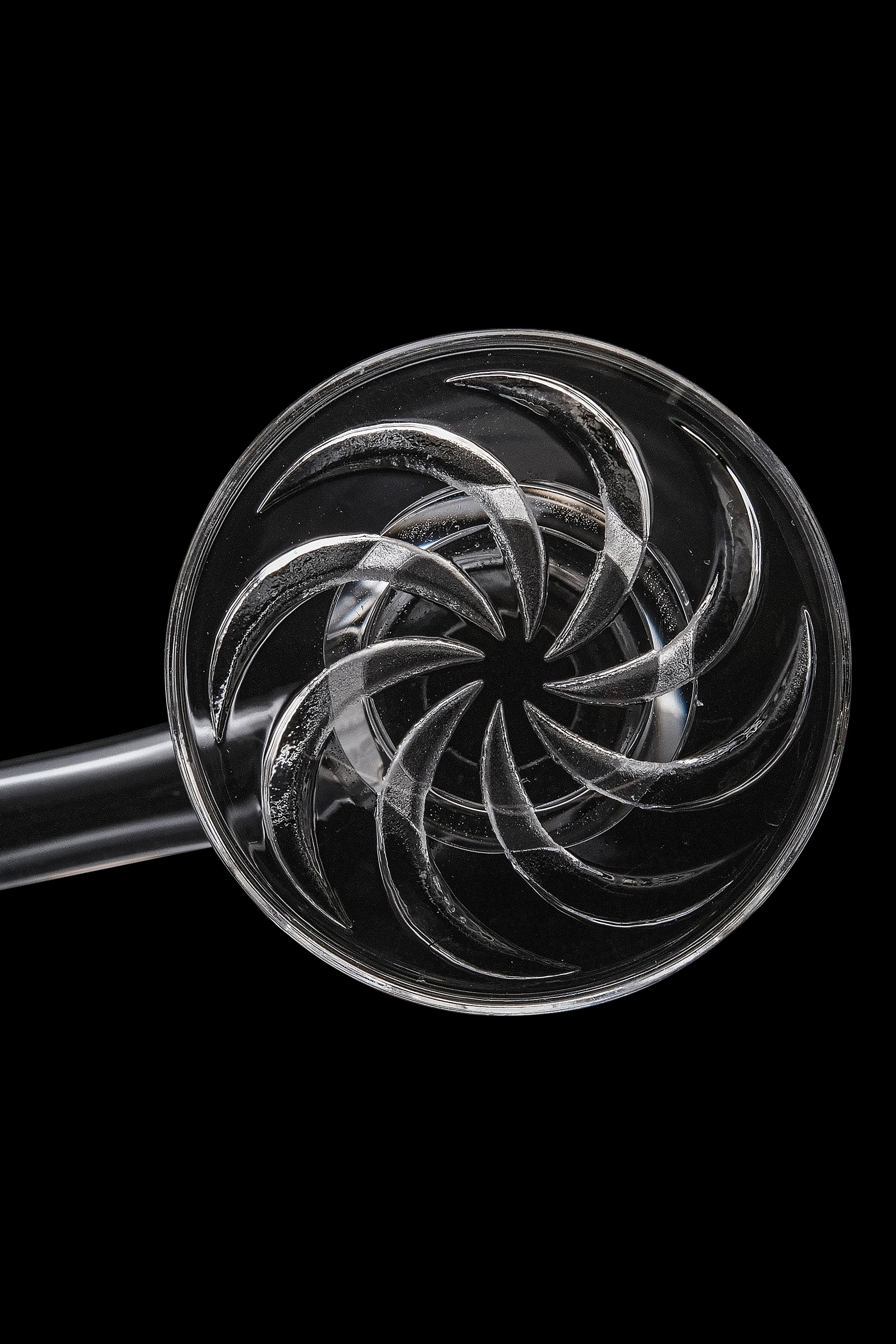 Clear glass cannabis oil rig with intricate spiral percolator.