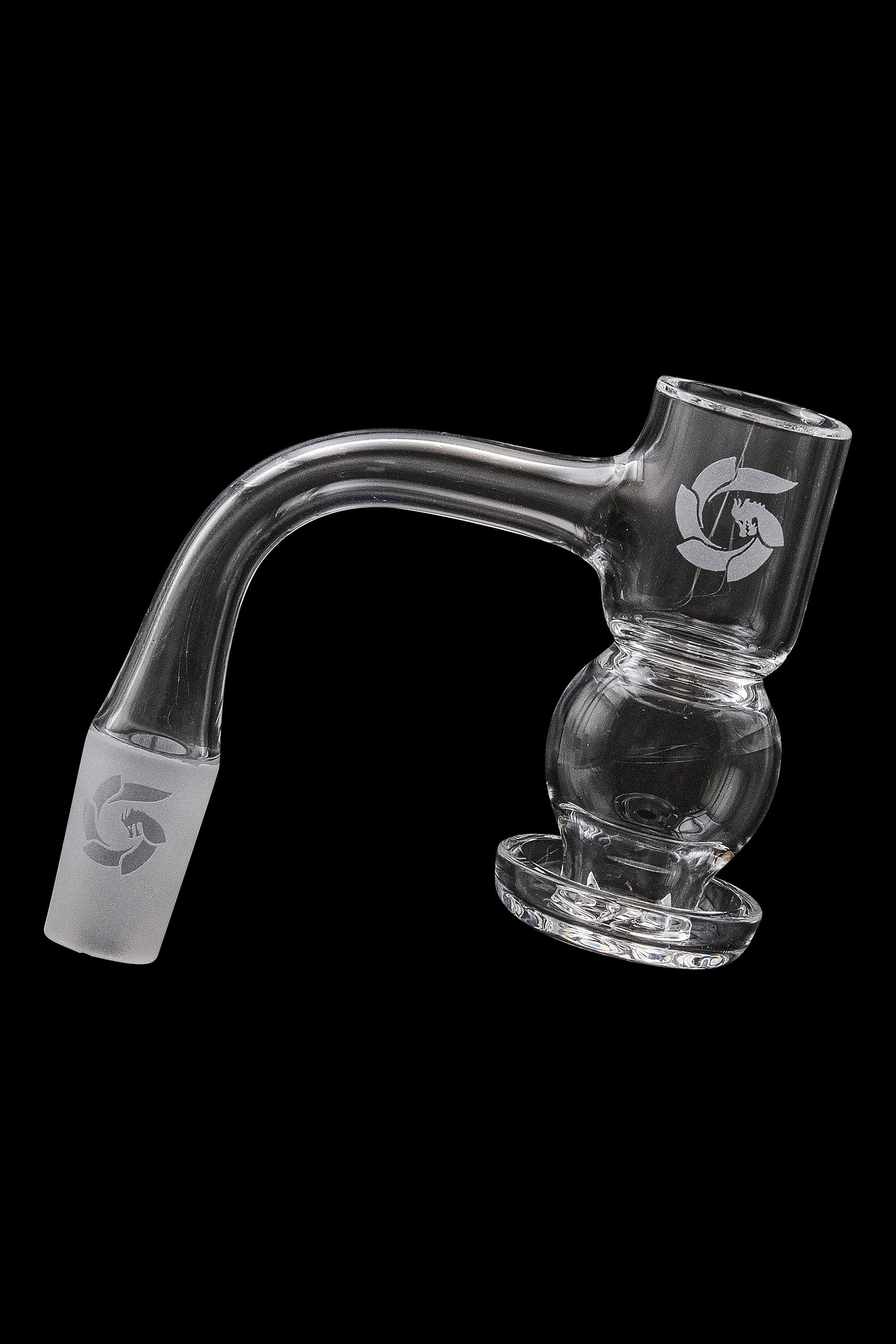 Clear glass dab rig with a bubbler design and branded logo, isolated on a black background.