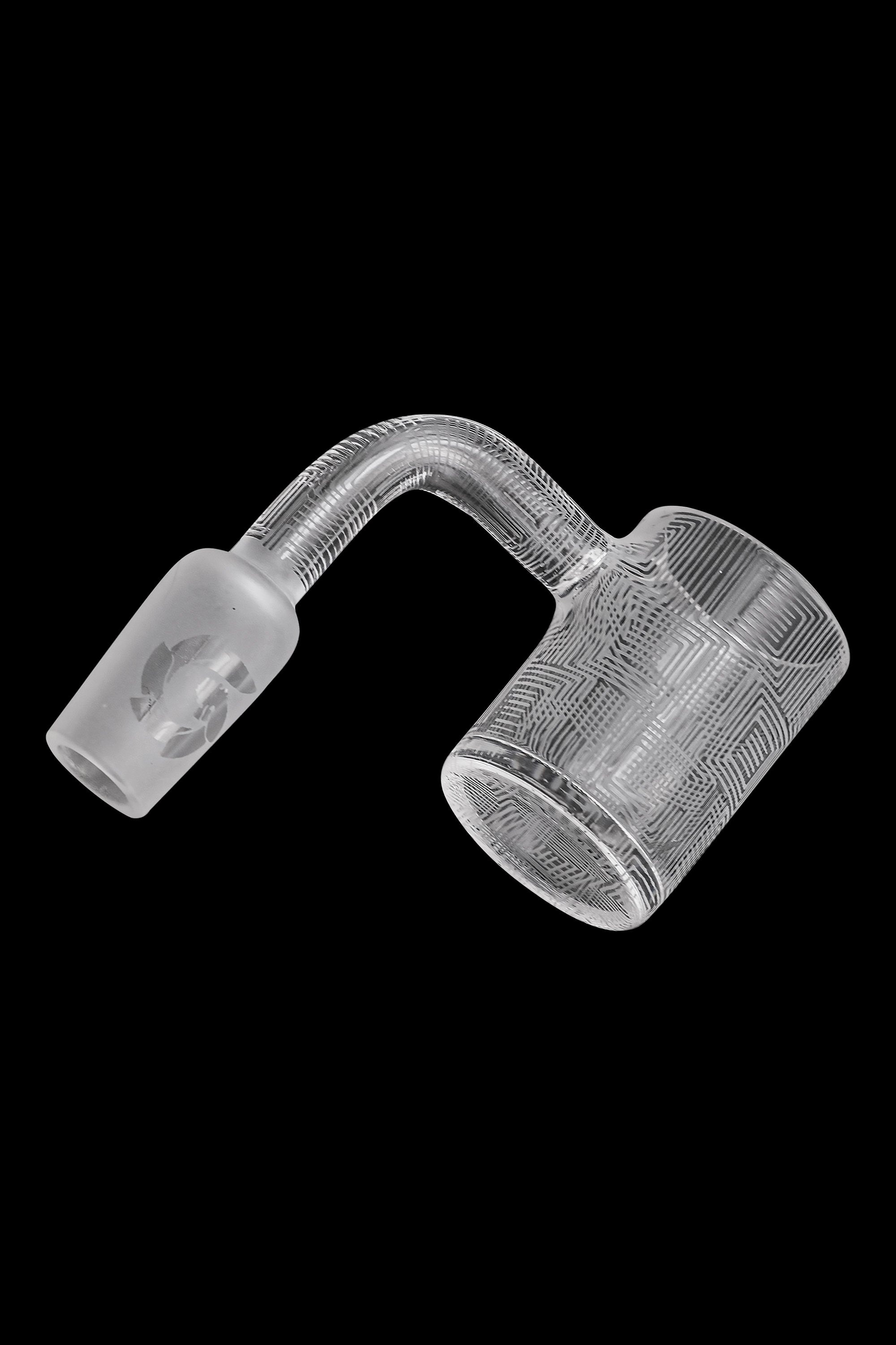 Clear glass cannabis oil rig carb cap with geometric pattern.