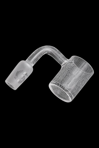 Clear glass cannabis oil rig carb cap with geometric pattern.