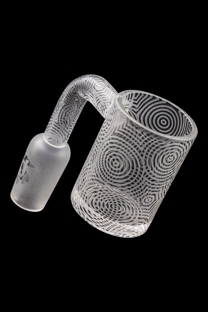 Frosted glass cannabis oil rig with intricate swirling patterns.