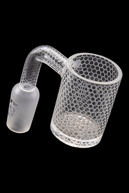 Frosted glass cannabis dab rig with honeycomb pattern.
