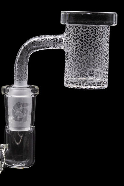 Clear glass bubbler water pipe with intricate geometric etching, isolated on a black background.