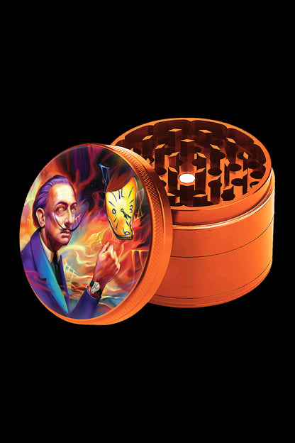 Orange grinder with a surrealist painting of Salvador Dali on the lid.