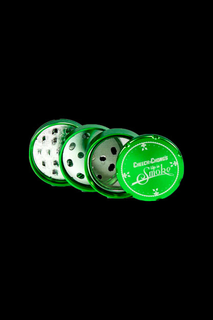 Green four-piece cannabis grinder with "Cheech & Chong's Up in Smoke" logo.