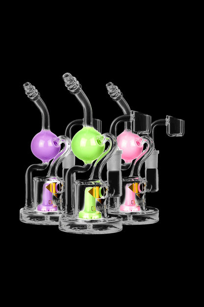 A front view of the Diamond Glass Buoy Recycler Rig, showing the clear glass bubbler with a rounded base and intricate neck design.