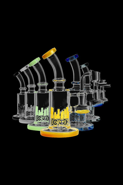 A studio shot of the Diamond Glass 'Hobbit' Dab Rig, showcasing its clear glass construction and compact size from a slightly elevated angle.