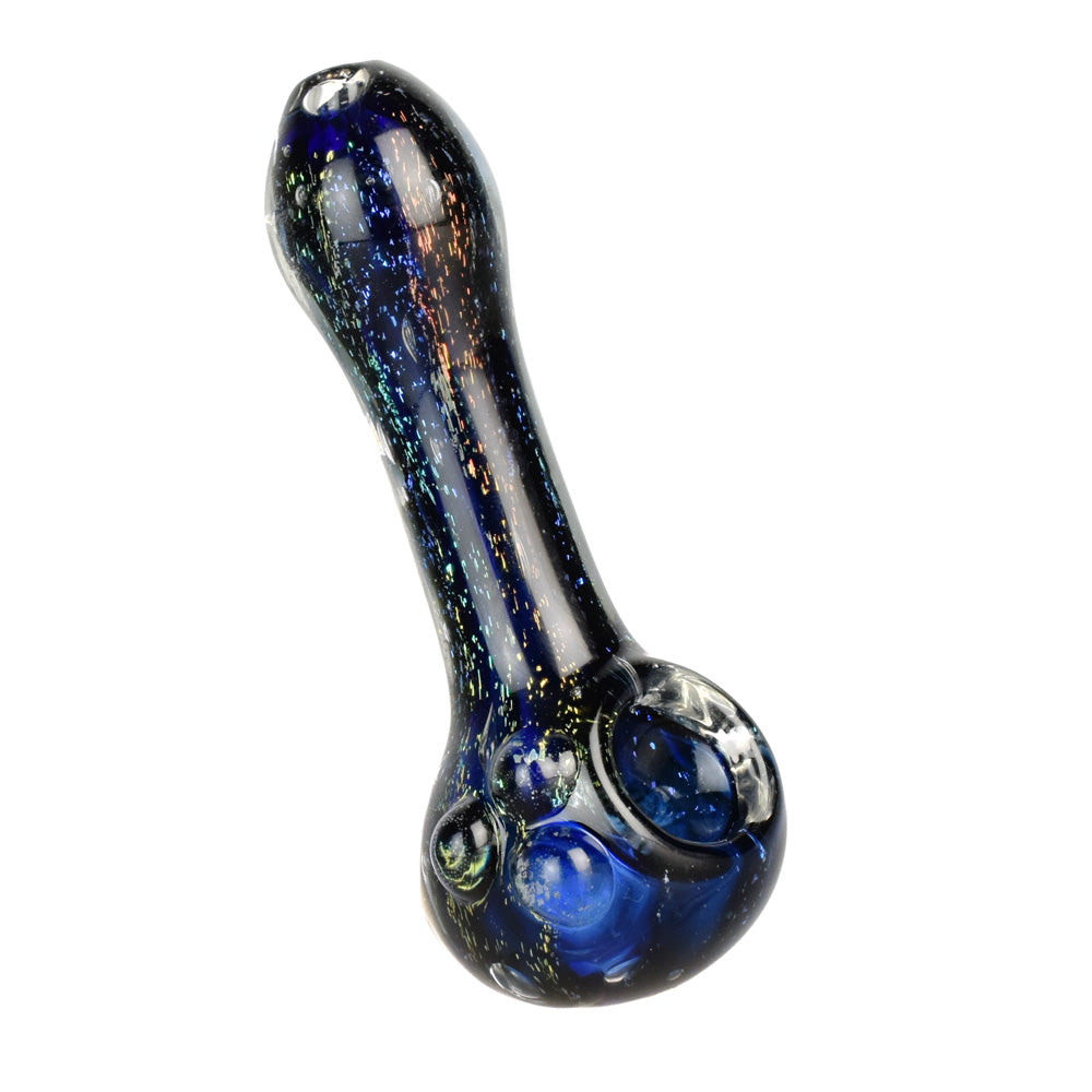 A three-quarter view of the Dichro Dream Spoon Pipe, showcasing its colorful dichroic glass and curved design.