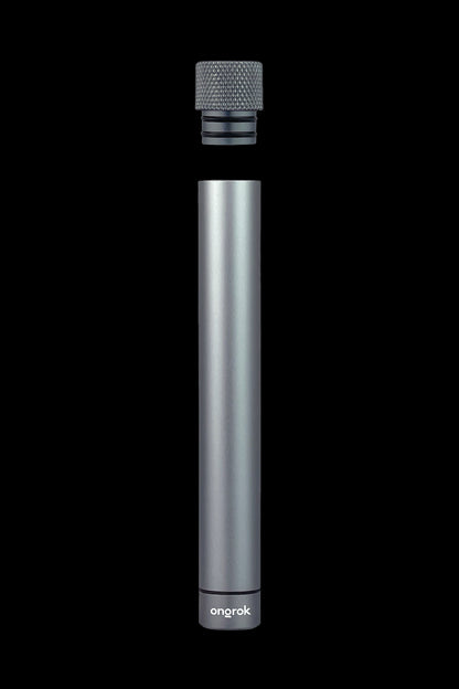 Sleek, cylindrical cannabis oil vape pen with separated mouthpiece on black background.