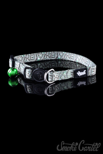 A close-up view of the HeadyPet Cat Collar, showcasing its patterned fabric design and adjustable buckle.